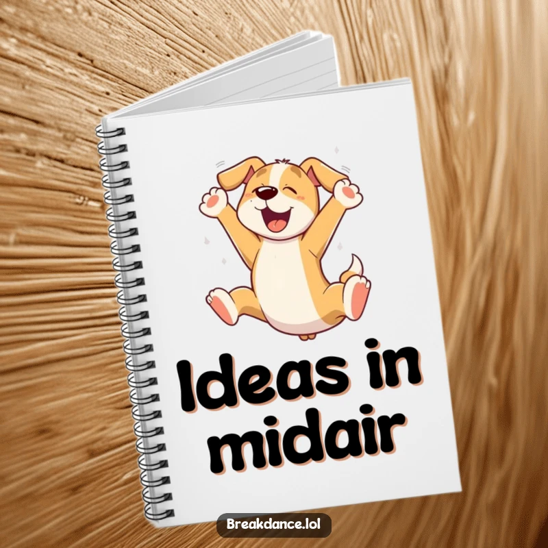 Funny dog leaping notebook, a cartoon dog mid-jump on the cover, ready to inspire creative writing.
